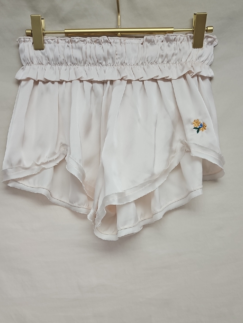 Free People Satin Cream Ruffle Hem Pajama Shorts with Yellow Floral Accent